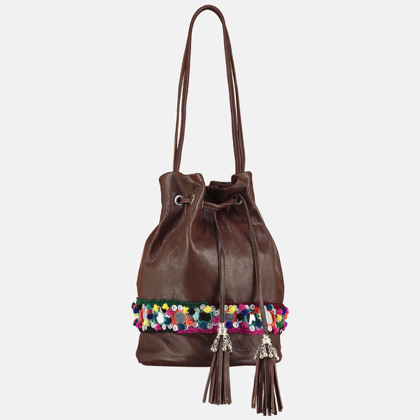 small bucket bag with metallic tribal tassles and  bright pom pom mirror belt detail 