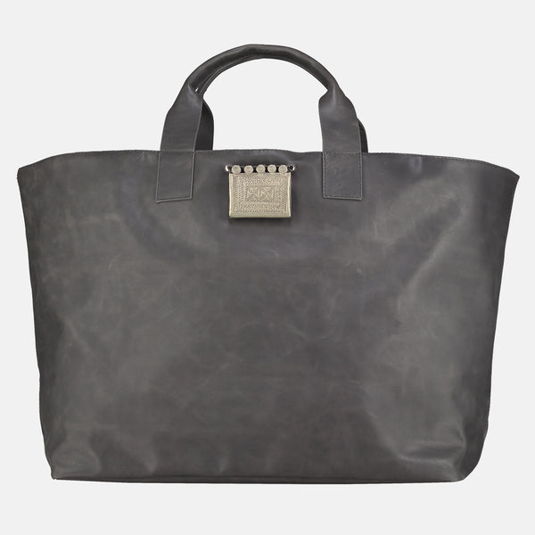 handmade leather  tote handbag in dark grey leather. vintage silver  tribal pendant detail. weekend bag travel bag , artisan