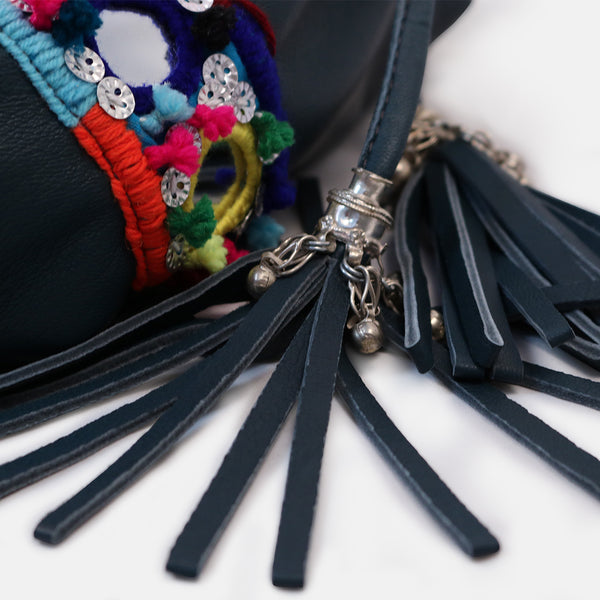 close up of tribal tassles and pompom mirrorwork 