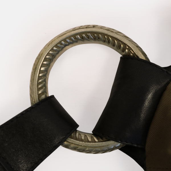 close up vintage tribal bracelet black leather shoulder bag