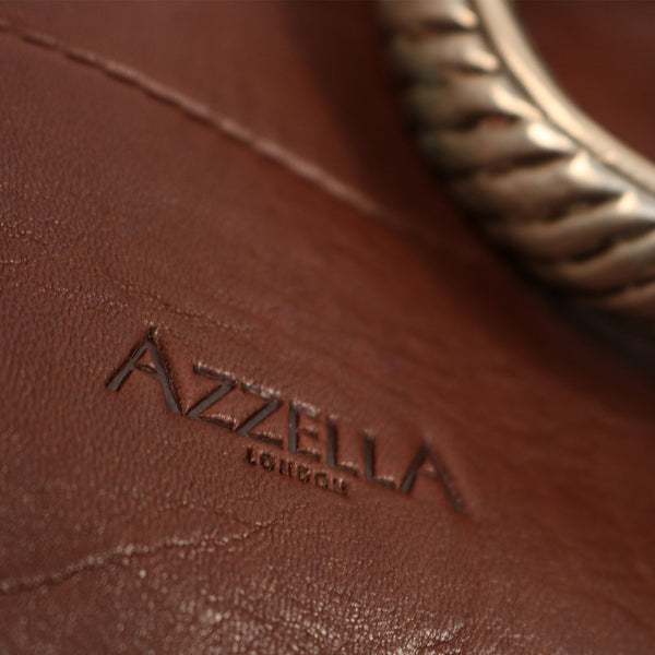 close up detail vintage tribal bracelet AzzellA logo on handmade handbag